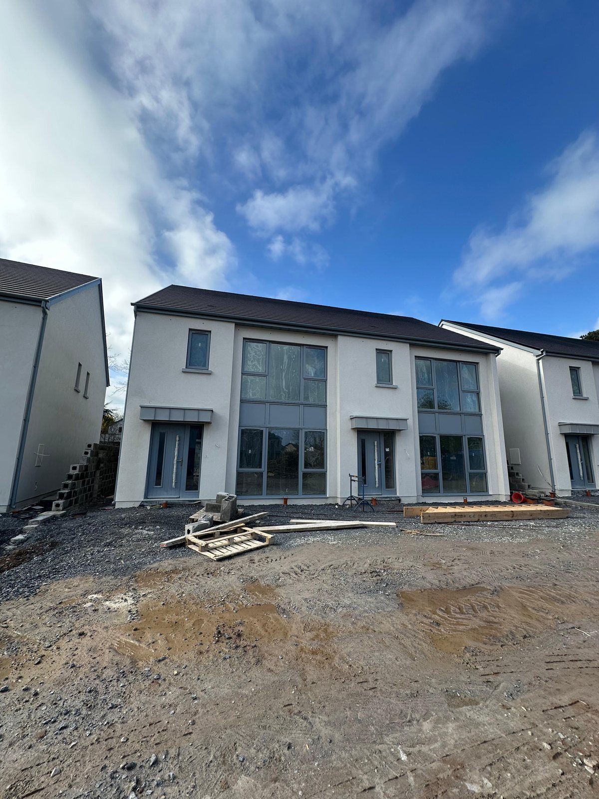 Raw smartphone photo of a property under construction